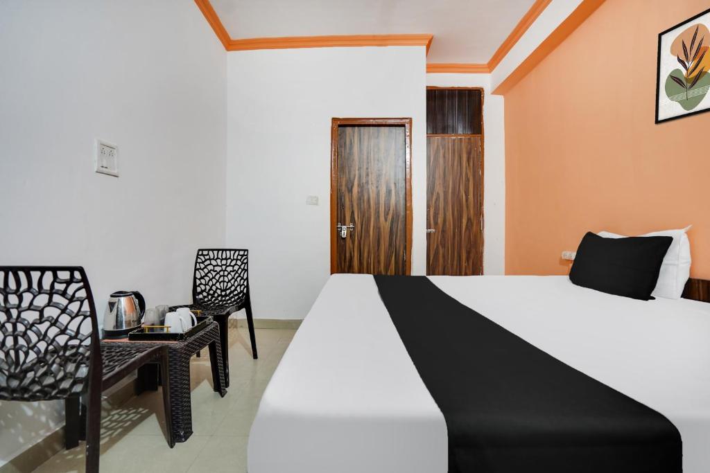 Postel nebo postele na pokoji v ubytování Hotel O Harmony