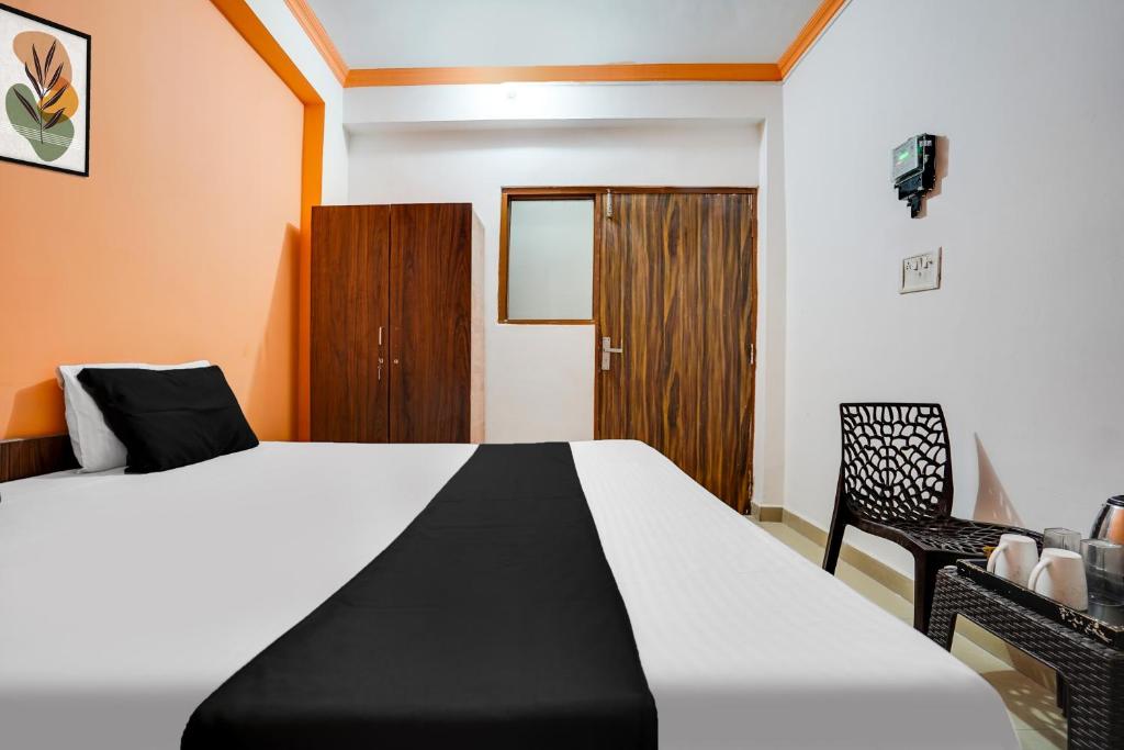 Postel nebo postele na pokoji v ubytování Hotel O Harmony