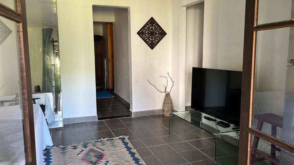 TV a/nebo společenská místnost v ubytování Casa da Ilha do Mel - Pousada de Charme