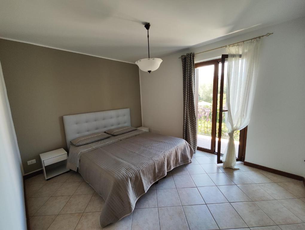 Postel nebo postele na pokoji v ubytování Casa Carini - Villa Vacanze sul Mare con piscina idromassaggio