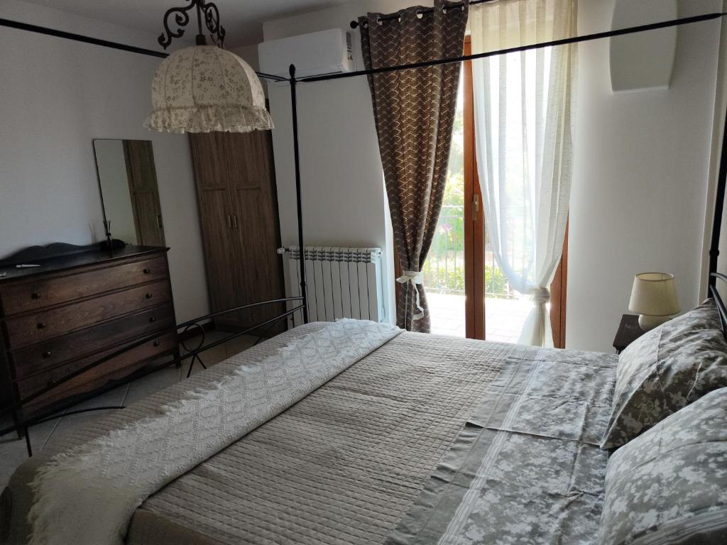 Postel nebo postele na pokoji v ubytování Casa Carini - Villa Vacanze sul Mare con piscina idromassaggio