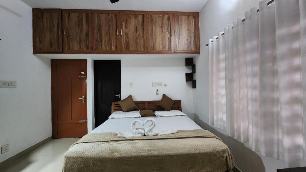 Postel nebo postele na pokoji v ubytování EBs Guest House