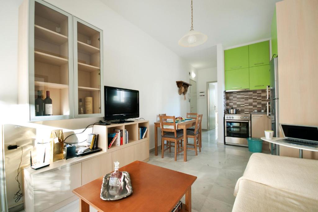 a living room with a couch and a table at Apostolaki A. Apartment in Rethymno Town