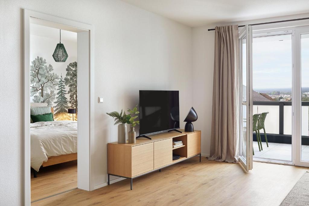 TV a/nebo společenská místnost v ubytování MATT - Apartments ' Design-Apartment mit Balkon
