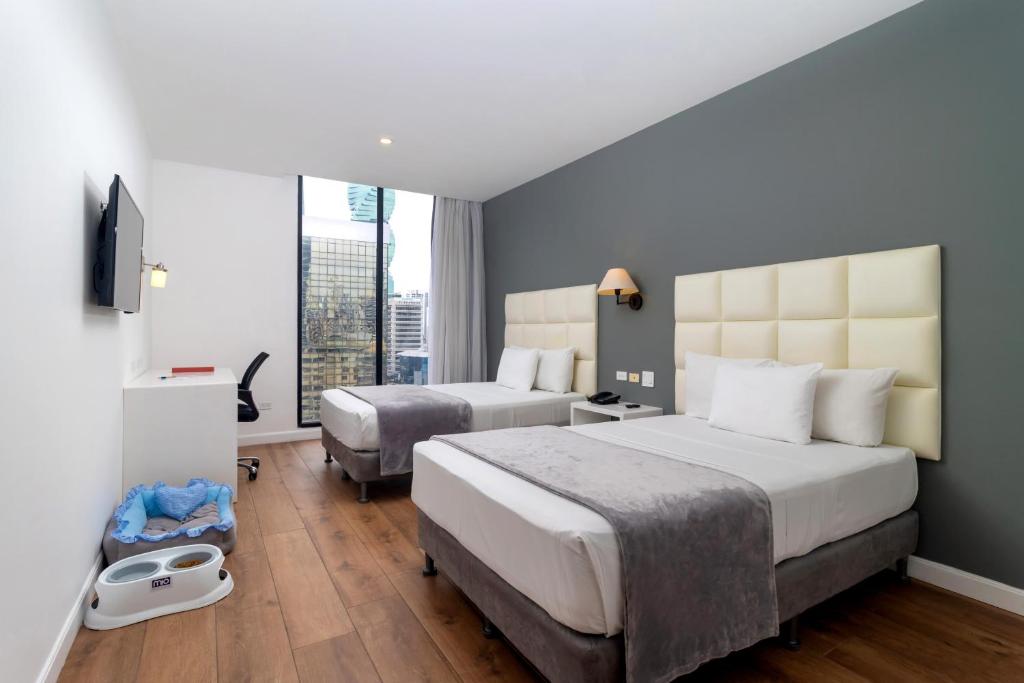 Postel nebo postele na pokoji v ubytování Hotel Mio Panamá