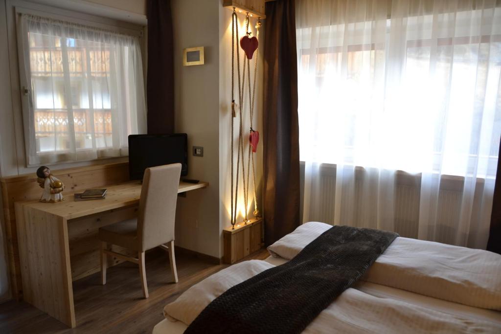 Postel nebo postele na pokoji v ubytování Hotel Azola