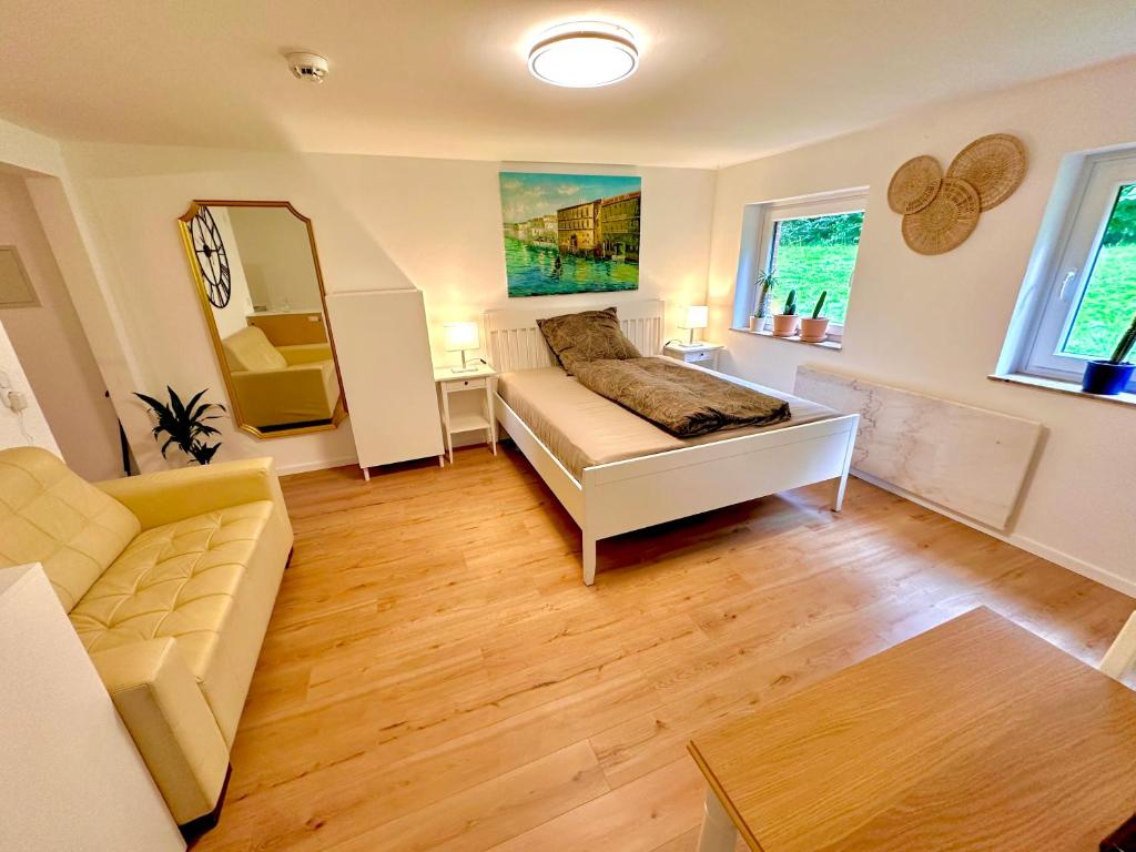 Postel nebo postele na pokoji v ubytování Akram Appartement V - für erholsame Ferien