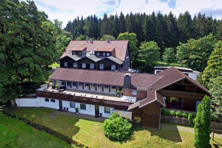 an aerial view of a large house at Ferienhaus im Kurort inkl Frühstück in Goslar