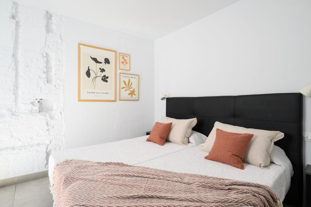 Posteľ alebo postele v izbe v ubytovaní Vegueta Rooftop Suites