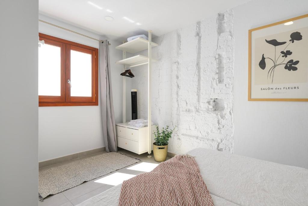 Posteľ alebo postele v izbe v ubytovaní Vegueta Rooftop Suites