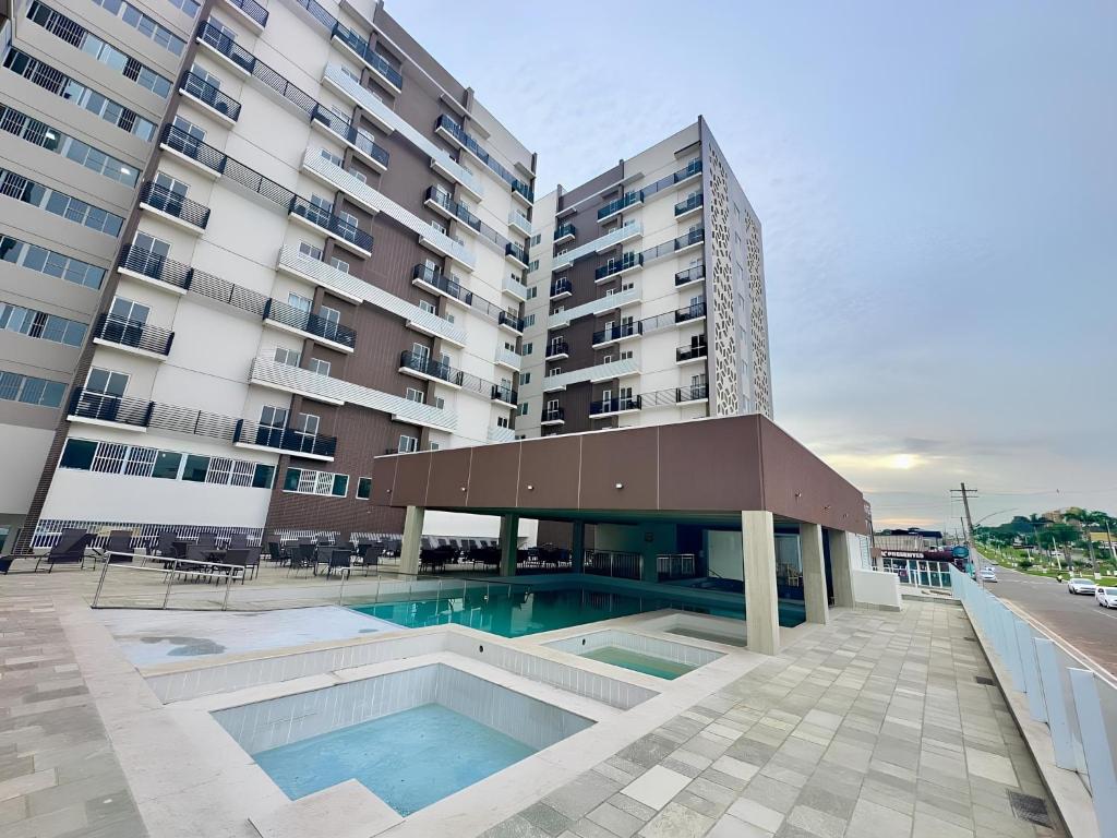 A piscina localizada em Spazzio Diroma Com acesso gratuíto ao Acqua Park - D ou nos arredores
