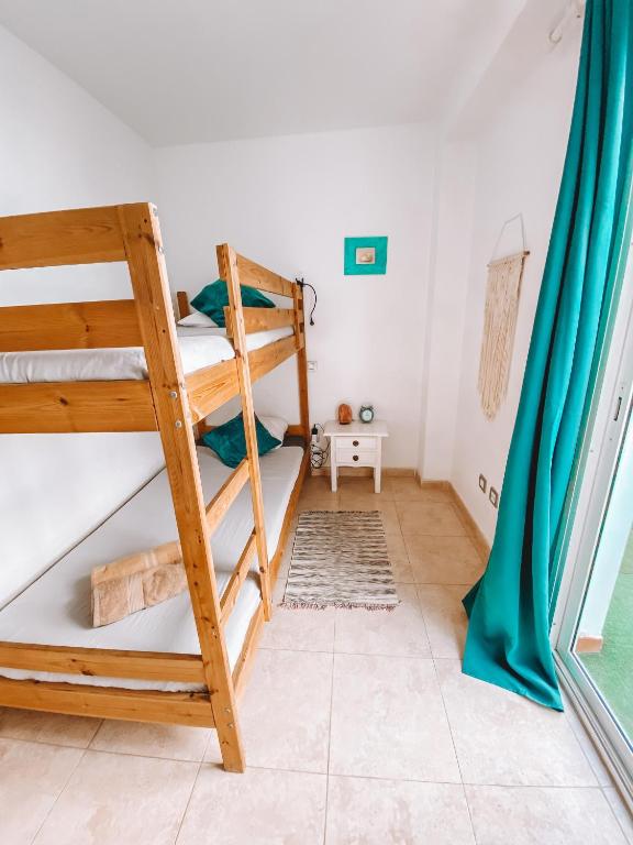 Posteľ alebo postele v izbe v ubytovaní Bamboo Apartment