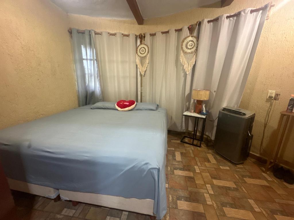 a bedroom with a bed with a bowl on it at Cabañas y hospedaje Sol y Luna Motul in Motul de Felipe Carrillo Puerto