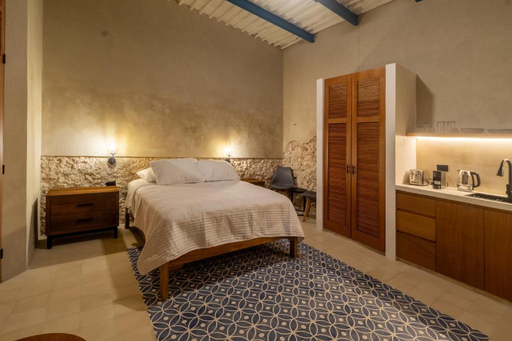 Postel nebo postele na pokoji v ubytování Casa Tunkul