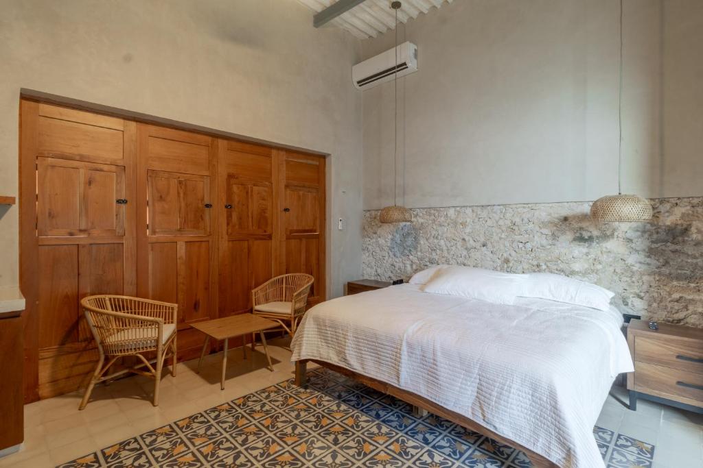 Postel nebo postele na pokoji v ubytování Casa Tunkul