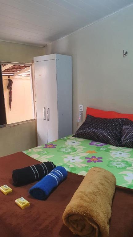 Postel nebo postele na pokoji v ubytování Quintal Hospedagem