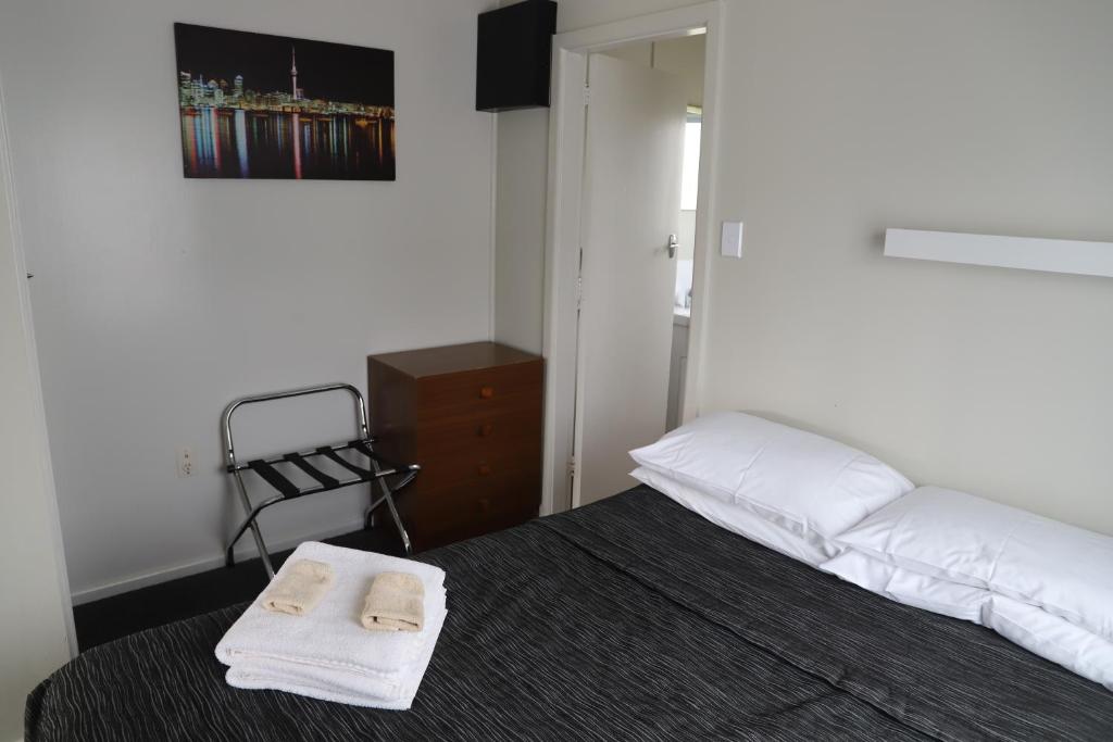 Postel nebo postele na pokoji v ubytování Sierra Beachfront Motel