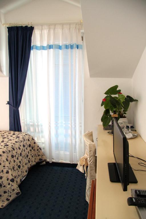 Postel nebo postele na pokoji v ubytování Hotel Villa Neretva - Metković