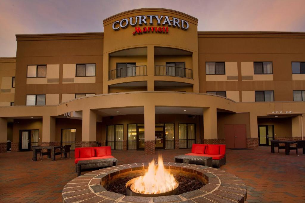 a hotel with a fire pit in front of a building at Courtyard by Marriott Waldorf in Waldorf