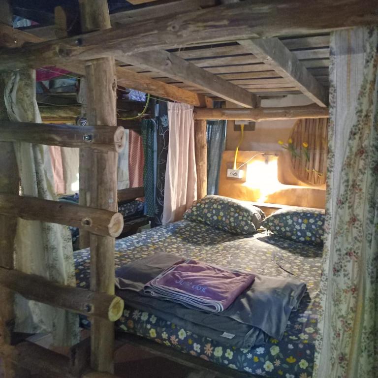 Postel nebo postele na pokoji v ubytování Doendin Mudbrick hostel
