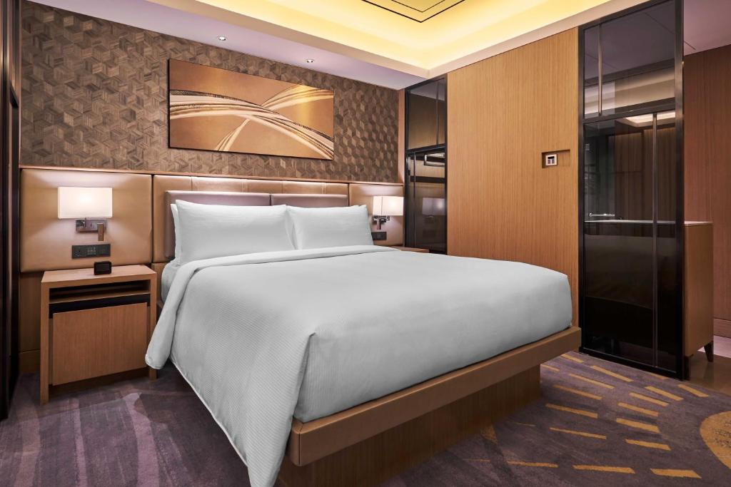 Postel nebo postele na pokoji v ubytování Hilton Manila