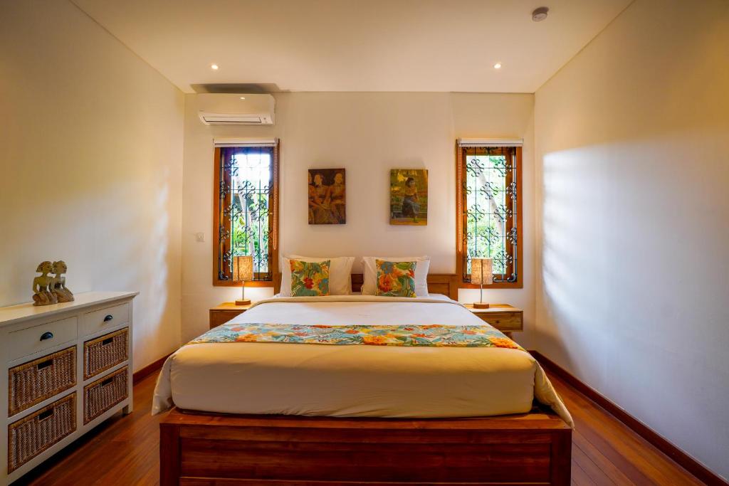 Postel nebo postele na pokoji v ubytování Paradise Garage Komodo Villa