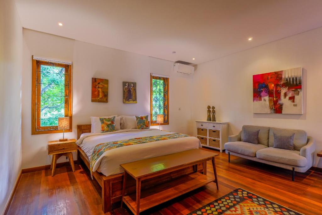 Postel nebo postele na pokoji v ubytování Paradise Garage Komodo Villa