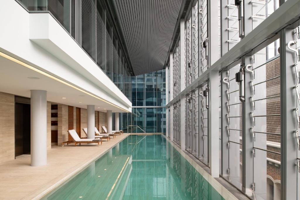 a swimming pool in the middle of a building at COMO The Treasury in Perth