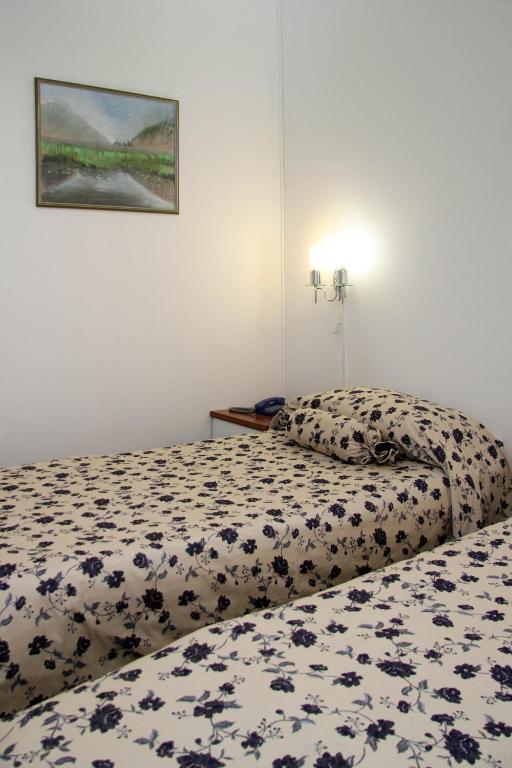 Postel nebo postele na pokoji v ubytování Hotel Villa Neretva - Metković