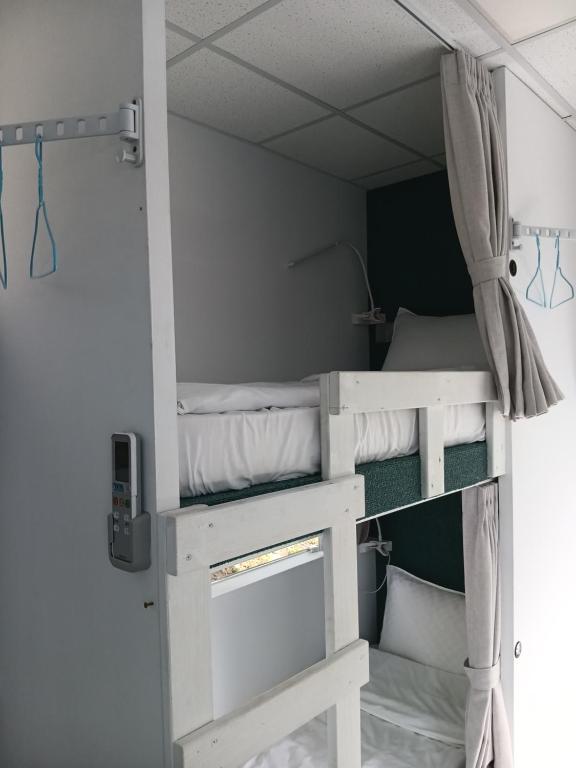 Postel nebo postele na pokoji v ubytování 高一 33 班 Homestay 1982