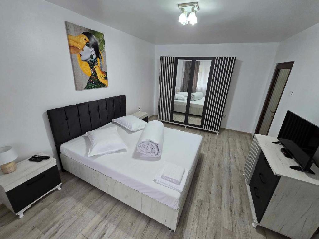 Ένα ή περισσότερα κρεβάτια σε δωμάτιο στο BlueBee Apartment