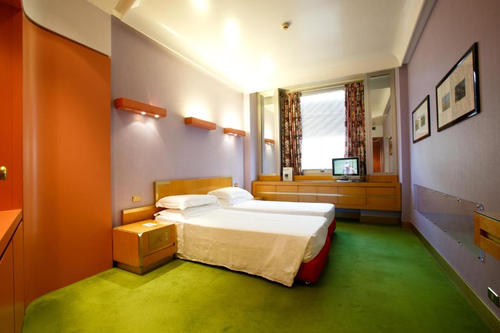 Postel nebo postele na pokoji v ubytování Albani Hotel Roma