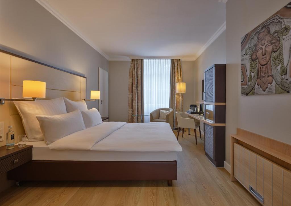 Postel nebo postele na pokoji v ubytování Steigenberger Hotel Bad Neuenahr