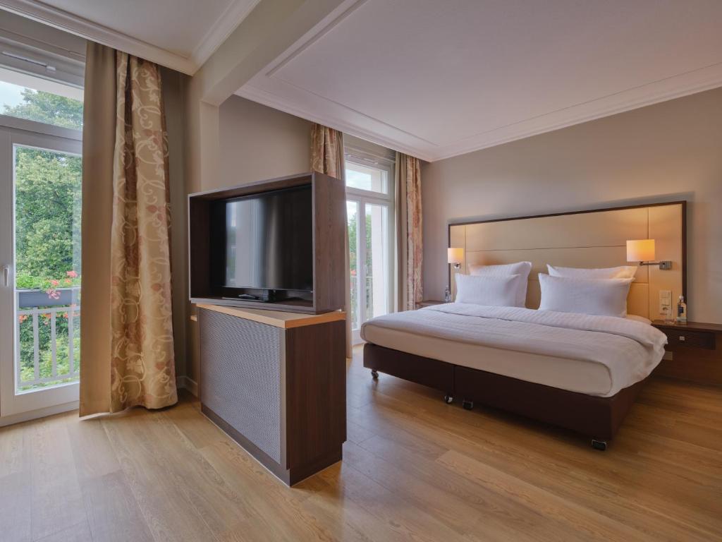 Postel nebo postele na pokoji v ubytování Steigenberger Hotel Bad Neuenahr