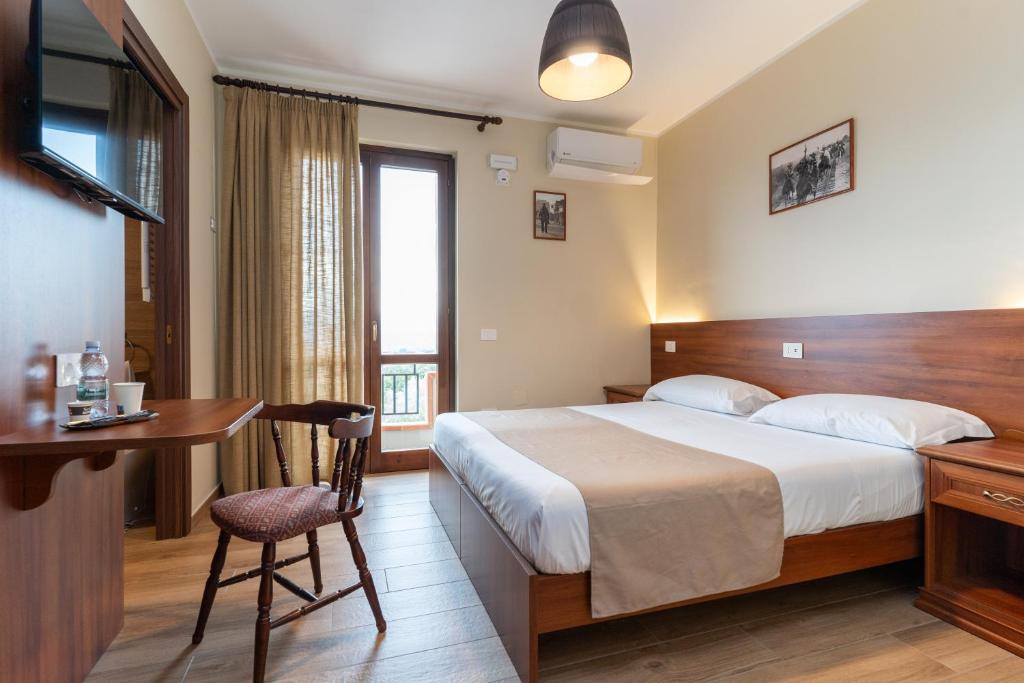 Postel nebo postele na pokoji v ubytování B&B Gusto West