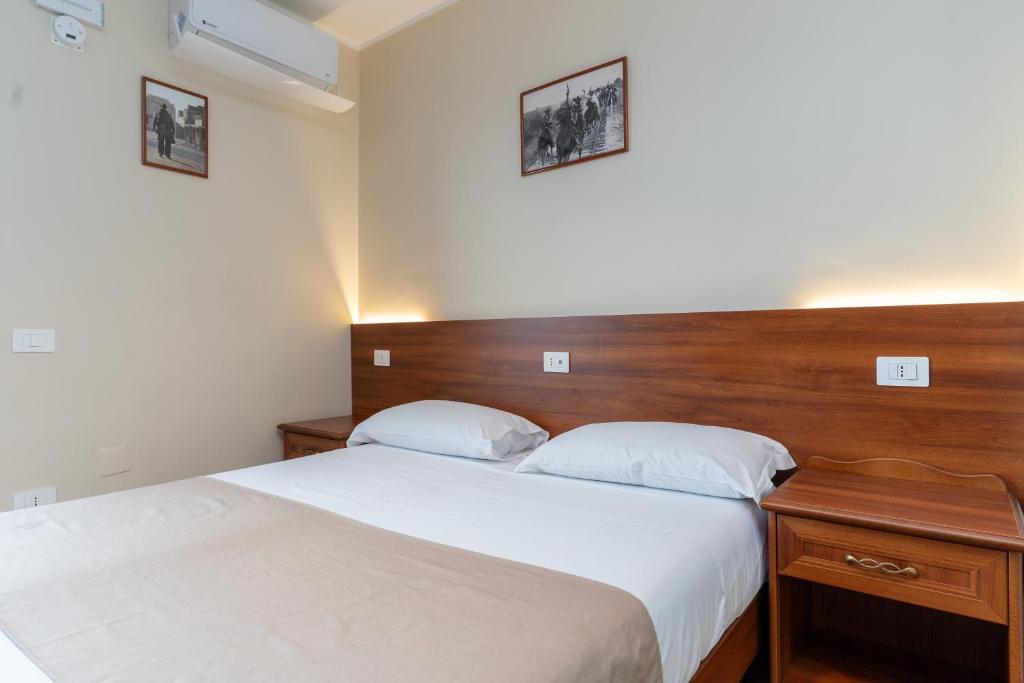 Postel nebo postele na pokoji v ubytování B&B Gusto West