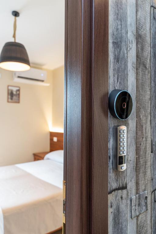 Postel nebo postele na pokoji v ubytování B&B Gusto West