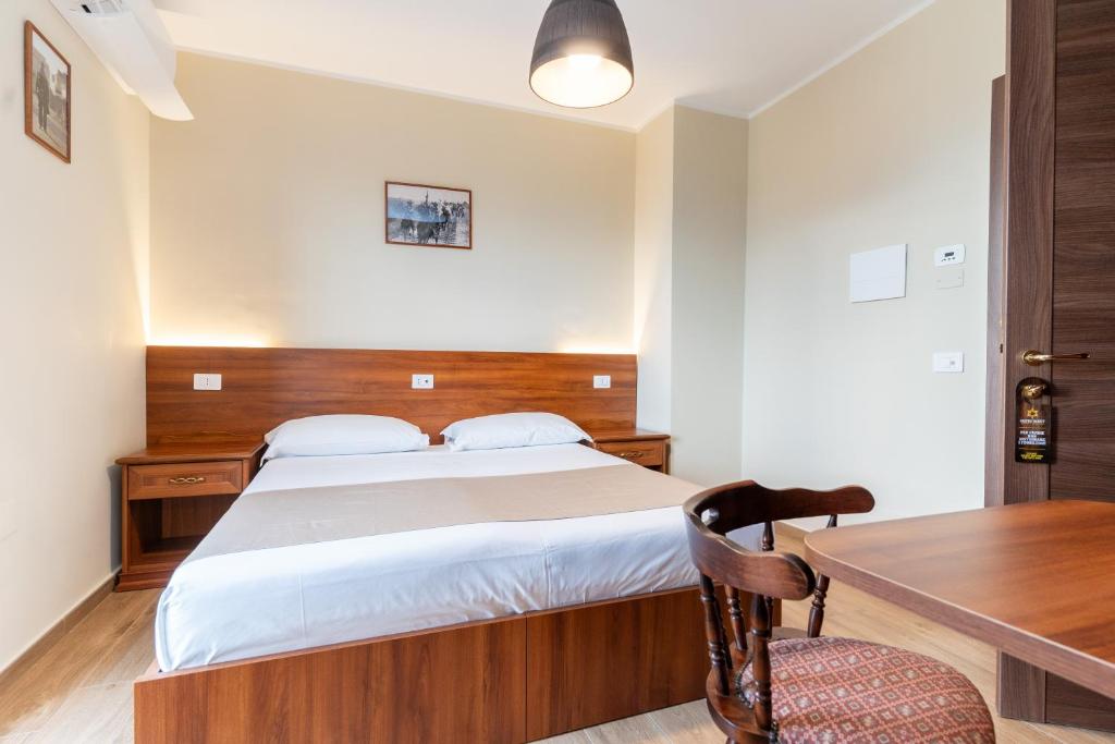 Postel nebo postele na pokoji v ubytování B&B Gusto West