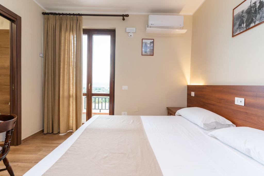 Postel nebo postele na pokoji v ubytování B&B Gusto West