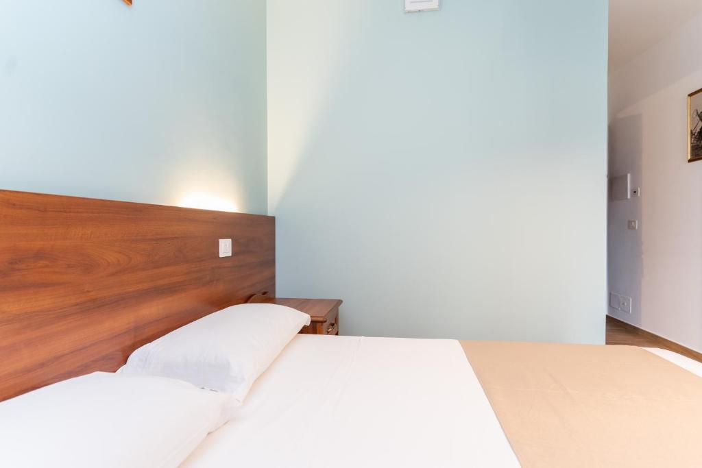 Postel nebo postele na pokoji v ubytování B&B Gusto West
