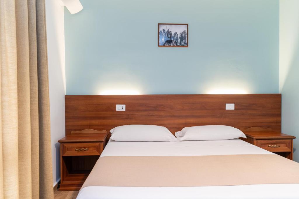Postel nebo postele na pokoji v ubytování B&B Gusto West