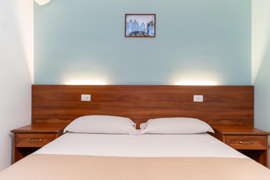 Postel nebo postele na pokoji v ubytování B&B Gusto West