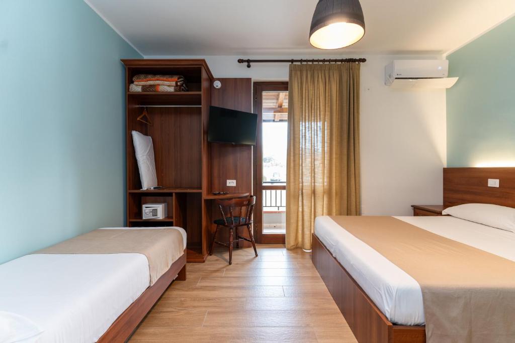 Postel nebo postele na pokoji v ubytování B&B Gusto West
