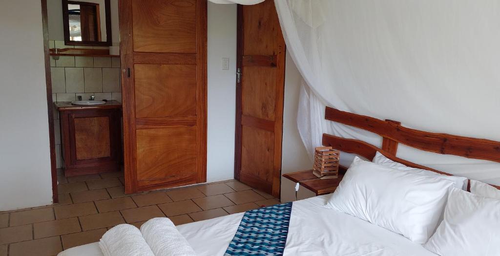 Postel nebo postele na pokoji v ubytování Bay View Lodge