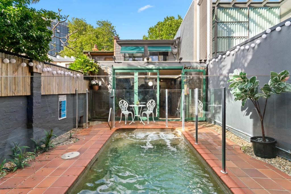 a koi pond in the backyard of a house at Country in City Darling Harbour Retreat Pool in Sydney
