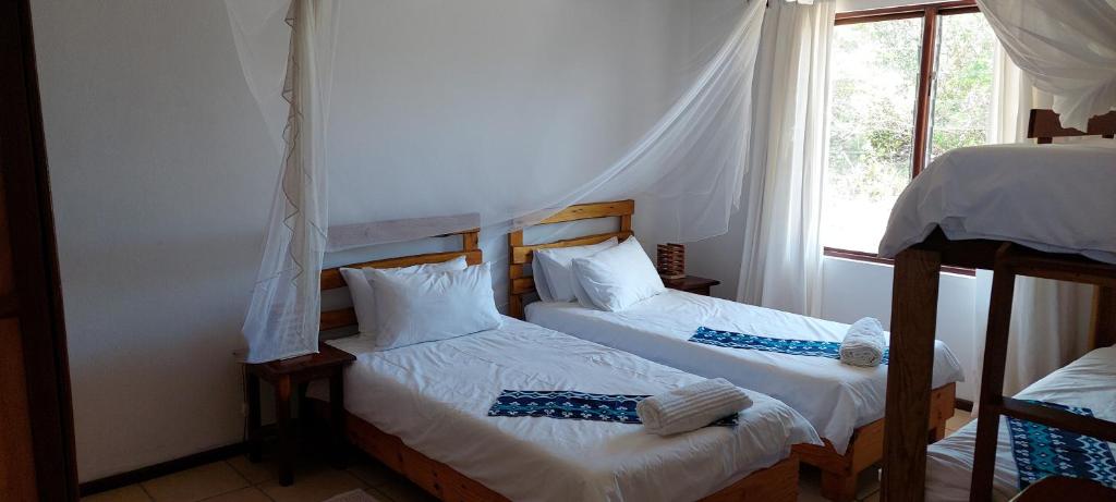 Postel nebo postele na pokoji v ubytování Bay View Lodge