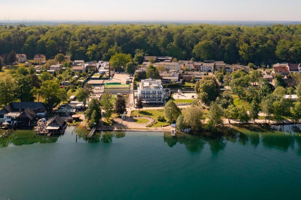an aerial view of a resort on a lake at Fontane Hotel in Schorfheide