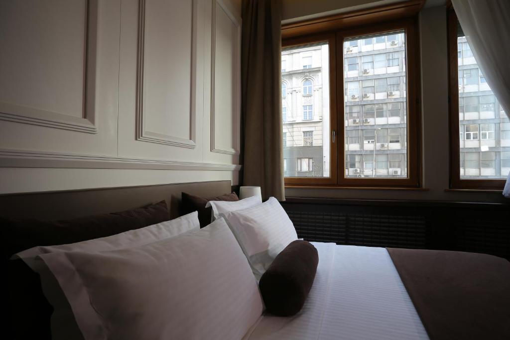 Postel nebo postele na pokoji v ubytování Belgreat Premium Suites