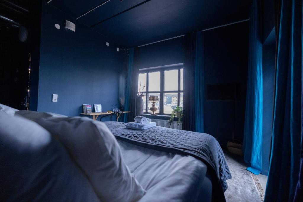 Postel nebo postele na pokoji v ubytování Sångbergs Hotell