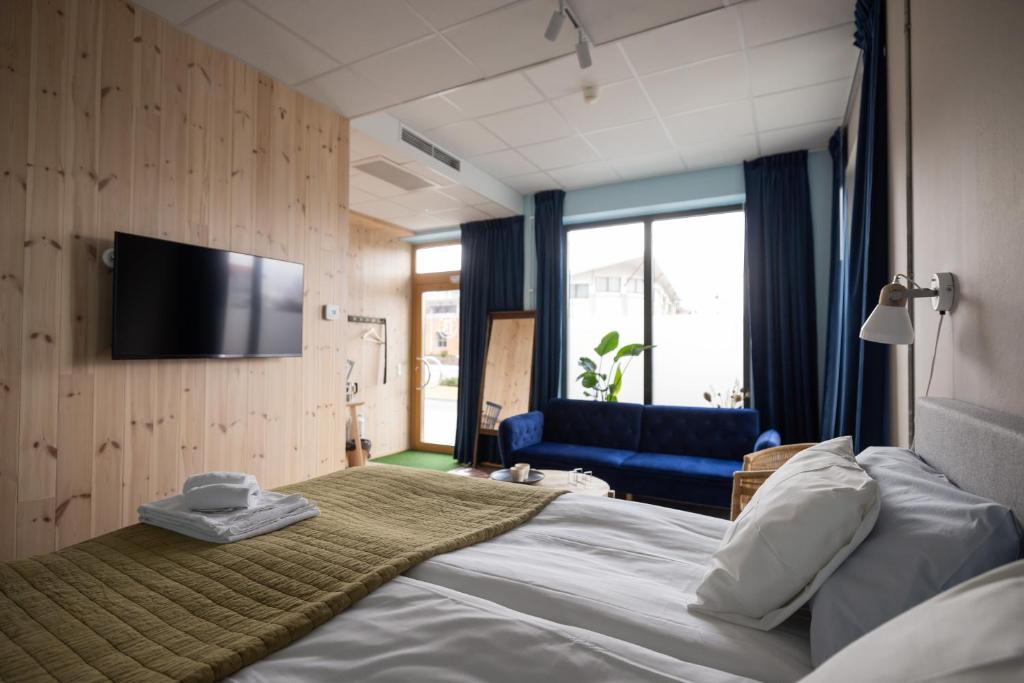 Postel nebo postele na pokoji v ubytování Sångbergs Hotell